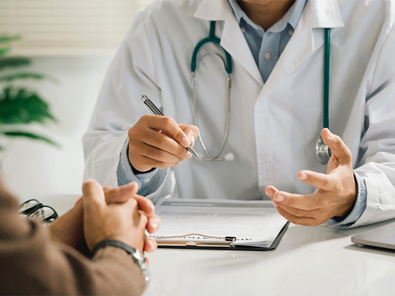 A Doctor consulting a patient